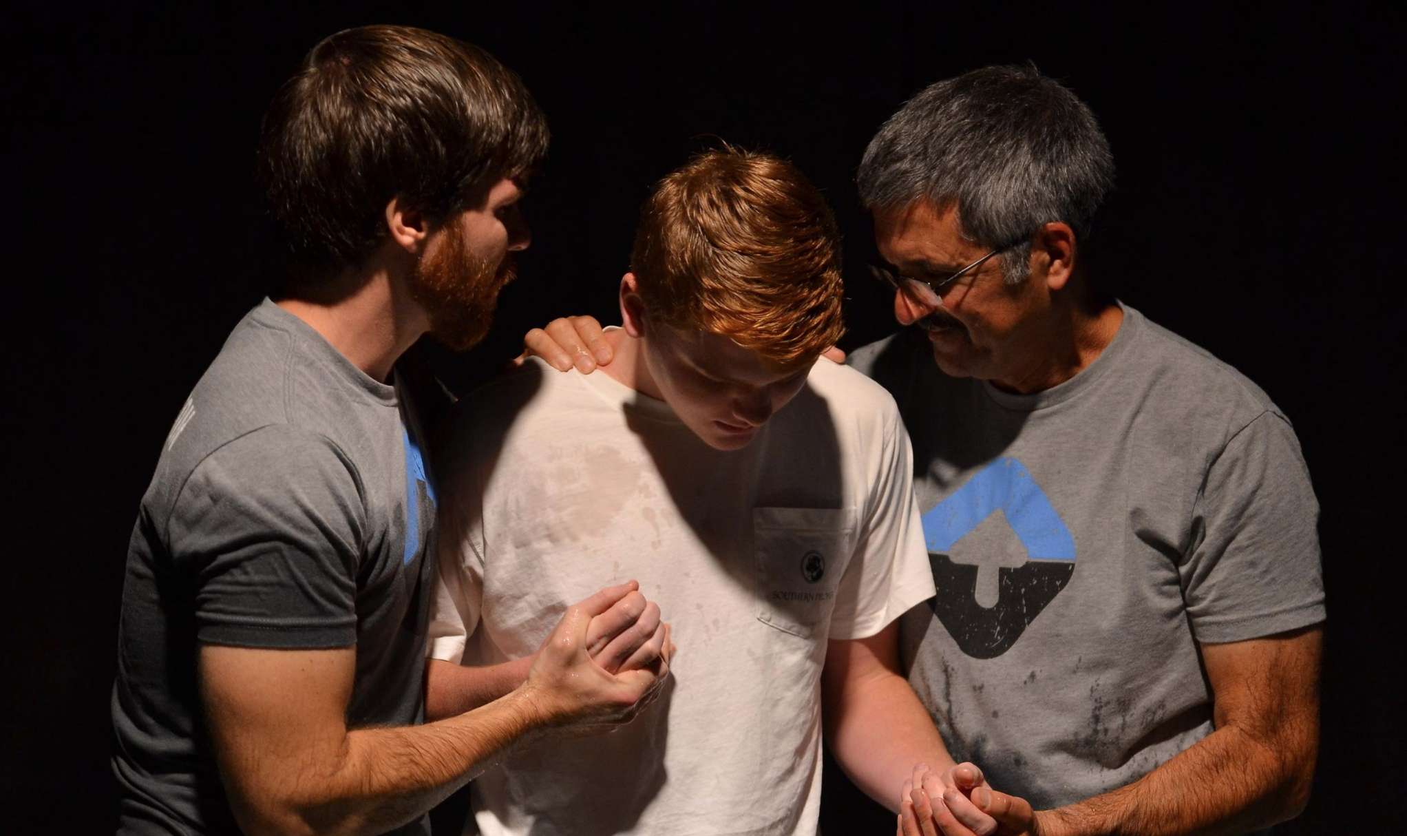 Pastors Matt and Mark baptizing a young man